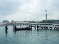 Quite a wharf at Singapore harbour with cloudy sky. Royalty Free Stock Photo